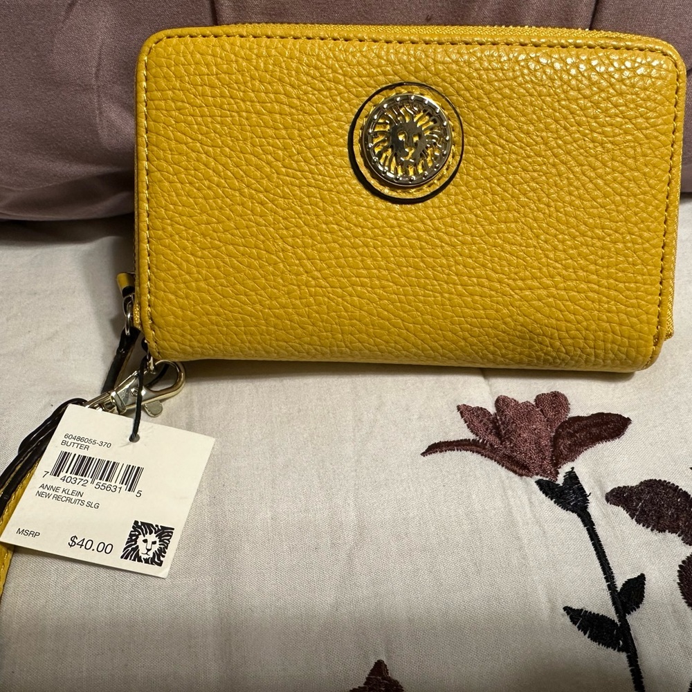 Brand new Anne Klein small wristlet w/ tags in a bright yellow color.